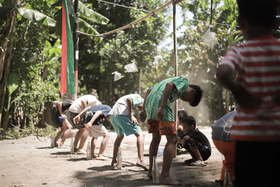 Group of people against trees