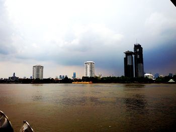 View of city against cloudy sky