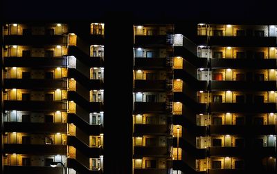 Apartment buildings lit up at night