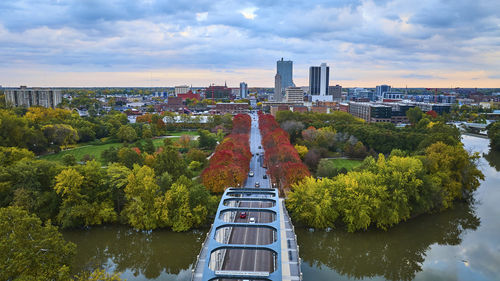 High angle view of buildings in city against sky