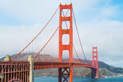 Golden gate bridge against cloudy sky