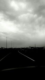 View of road against cloudy sky