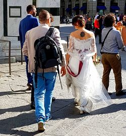Rear view of couple standing outdoors