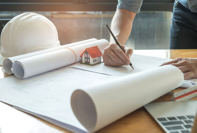 Midsection of woman working on table