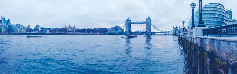 View of bridge over river in city