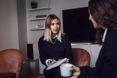 Female coworkers having meeting in office