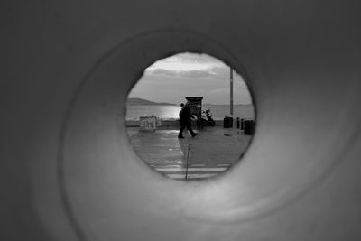 People seen through hole in sky of perspective