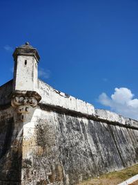 Low angle view of old building against sky