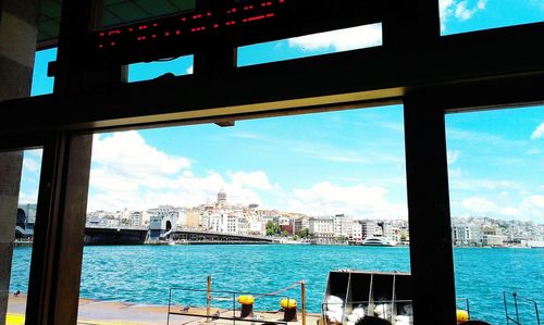 View of harbor against cloudy sky