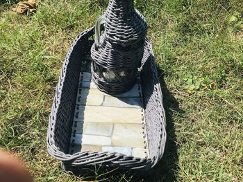 High angle view of shoes on field during sunny day