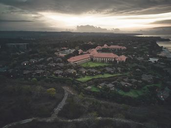 Aerial view of town against sky at sunset