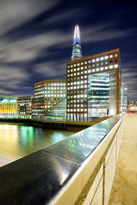 Illuminated buildings in city at night