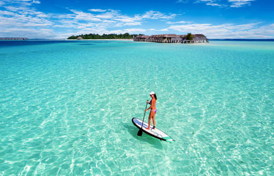 Scenic view of boat in sea against sky