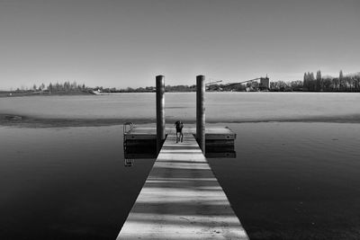 Pier over lake against sky