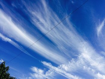 Low angle view of vapor trails in sky