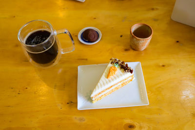 High angle view of coffee served on table