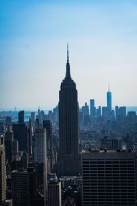 Modern buildings in city against sky
