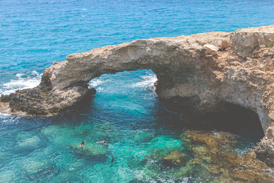 High angle view of people swimming in sea