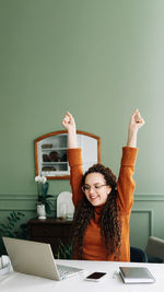 Young woman using laptop at home