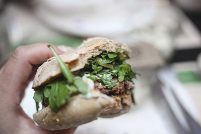 Close-up of hand holding bread