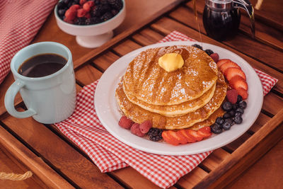 Close-up of pancakes served on table