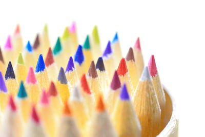 Close-up of colorful pencils on white background