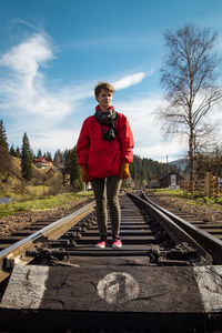 Tourist with camera on railway road scenic photography