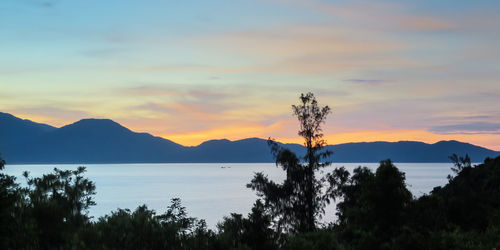 Scenic view of mountains against sky at sunset