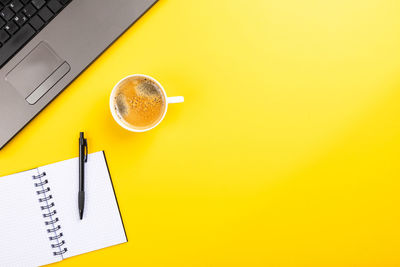 High angle view of coffee cup on table