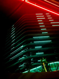 Low angle view of illuminated lights on building at night