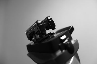 Close-up of vintage car on table against white background