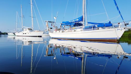 Boats moored at harbor