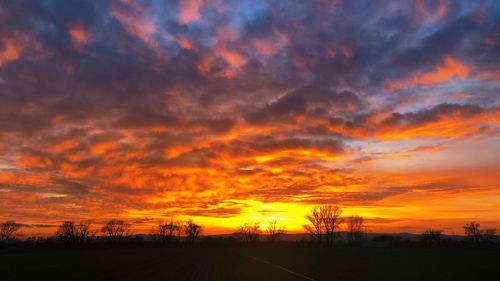 Scenic view of dramatic sky during sunset