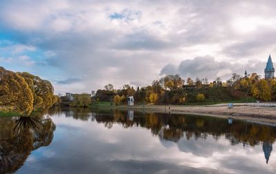 Reflection of trees in lake against sky