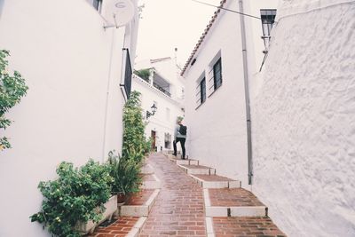 Narrow alley along buildings