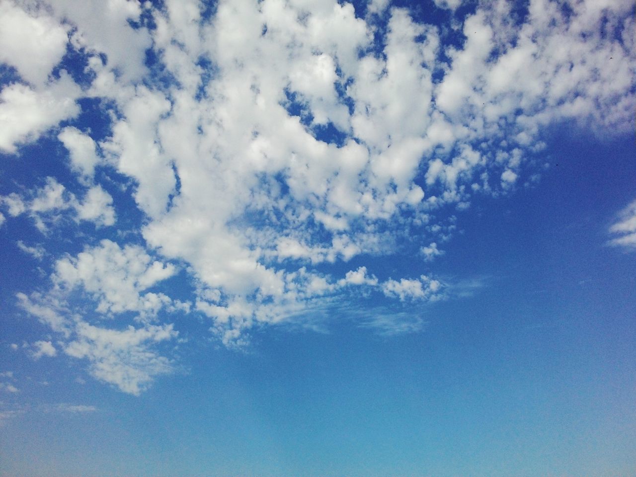 sky, cloud - sky, blue, low angle view, tranquility, beauty in nature, scenics, sky only, tranquil scene, nature, cloudy, backgrounds, cloud, cloudscape, full frame, white color, idyllic, day, outdoors, no people