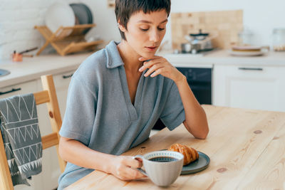 Portrait of young woman using mobile phone