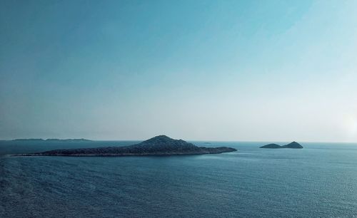 Scenic view of sea against clear blue sky