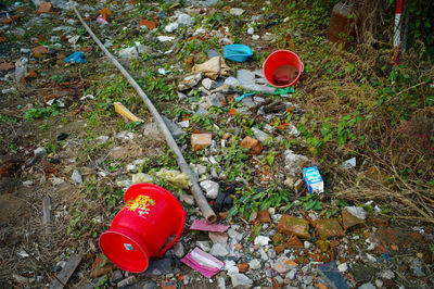 High angle view of garbage can on field