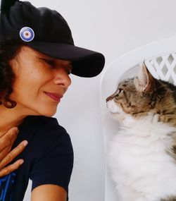 Midsection of woman with cat