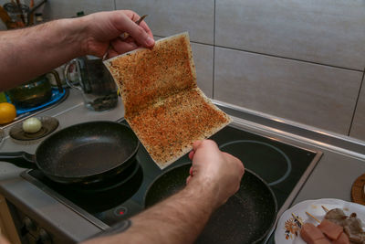 Midsection of person preparing food at home