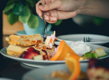 Close-up of man holding food