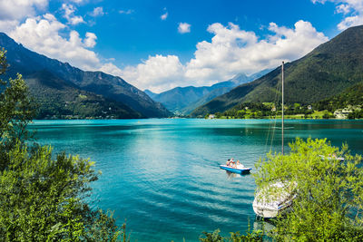 Scenic view of lake and mountains against sky