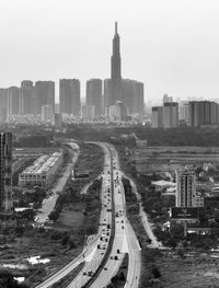 High angle view of street and buildings against sky