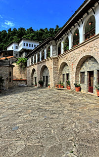 Low angle view of old building against trees