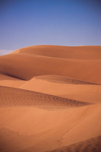 Scenic view of desert against clear sky