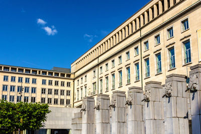 Low angle view of building against blue sky