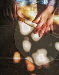 High angle view of person preparing food on table