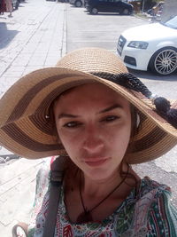Portrait of young woman in hat