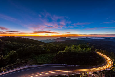Scenic view of road against sky during sunset